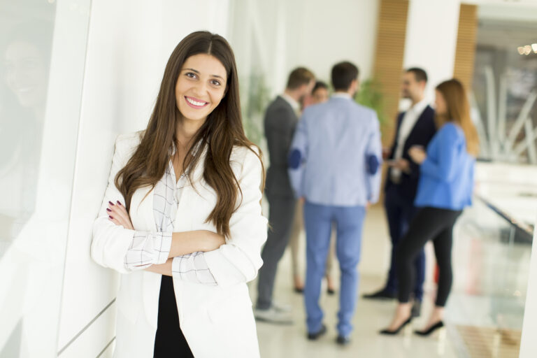 Young woman standing out in a crowd